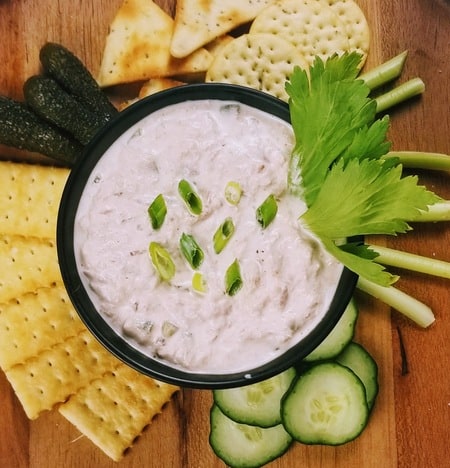 Smoked Tuna Dip in a small bowl surrounded by crackers and vegtables