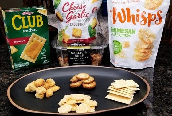 toppings for tuna pasta on a plate, crackers, croutons and chips