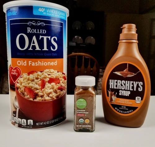 add ins for peach cobbler dump cake oatmeal, cinnamon and caramel syrup in their containers on counter