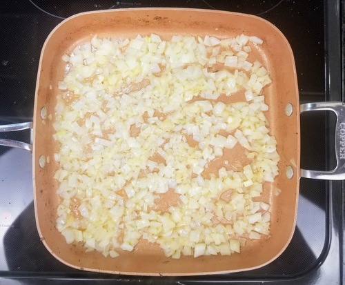 onions sauteing in a pan