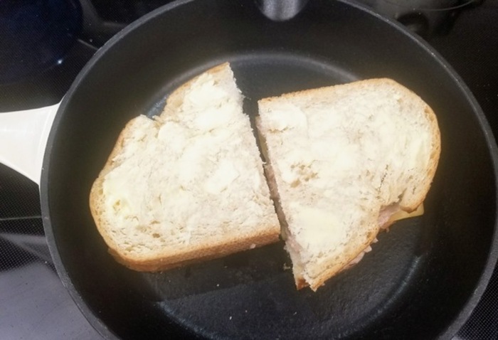 grilled tuna sandwich cooking on a cast iron skillet