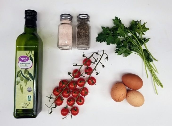 ingredients for fried eggs in Olive oil with cherry tomatos